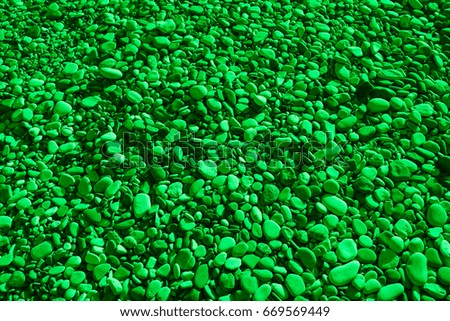 Green colored stones of the beach of Aphrodite. Souvenirs as a gift. The rock of the Greek (Petra tou Romiou). Paphos region. Cyprus island. Background