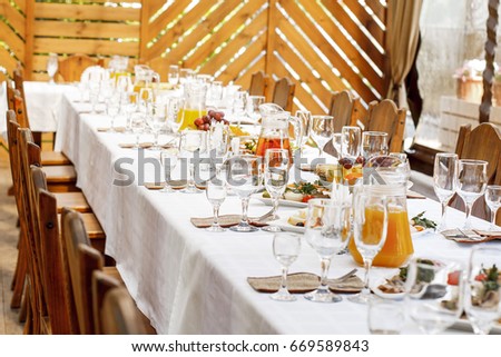 Table Setting Food Celebration Party Concept. Served table at summer terrace cafe