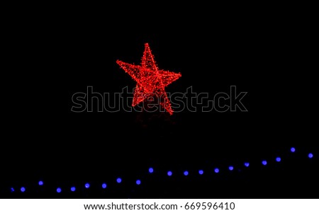 A red star Christmas tree topper