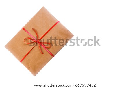 Gift in wrapping paper and bandaged red ribbon isolated on white background with space for text, top view close-up. mock up for text, phrases, congratulations, lettering