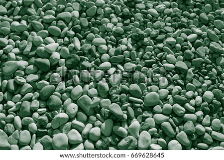 Moonlight colored stones of the beach of Aphrodite. Souvenirs as a gift. The rock of the Greek (Petra tou Romiou). Paphos region. Cyprus island. Background