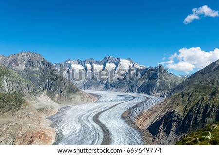 A view of the Aletsch glacier and surrounding mountains in Switzerland.