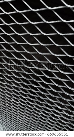 Kuala Lumpur, Malaysia, July 2017, steel bar weaving to rhombus shape connection as a cage or wall for keep something inside, this picture is suitable for background