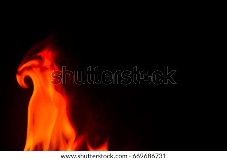 Red fire flames on a black background
