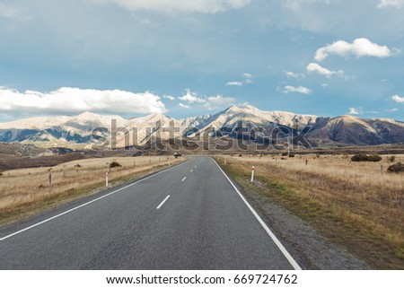 A road to mountain with clear sky in New Zealand