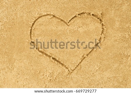heatr shape drawing in sand background