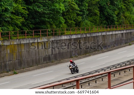 Motorcycle on German autobahn Royalty-Free Stock Photo #669741604