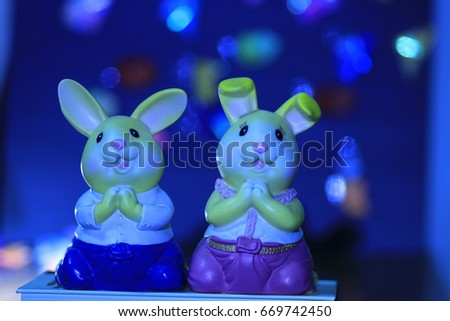 two rabbit dolls and many color bokeh