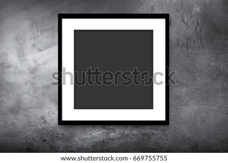 black modern frame hanging on gray wall