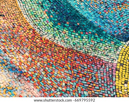 Detail of beautiful old collapsing abstract ceramic mosaic adorned building. Venetian mosaic as decorative background. Selective focus. Abstract Pattern. Abstract mosaic colored ceramic stones Royalty-Free Stock Photo #669795592