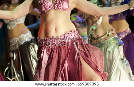 Girls without heads dance oriental dances Royalty-Free Stock Photo #669809095