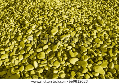 Yellow stones of the beach of Aphrodite. Souvenirs as a gift. The rock of the Greek (Petra tou Romiou). Paphos region. Cyprus island. Background