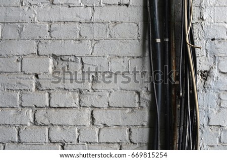 electric wires on brick wall