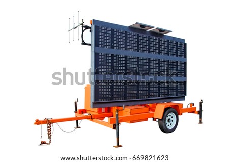Portable electronic highway information billboard mounted on orange trailer. Isolated.