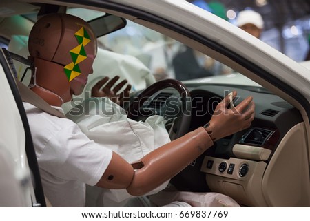 Crash Test Dummy in a car after a Crash Test. Royalty-Free Stock Photo #669837769
