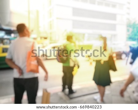 Abstract blurred image background of People waiting for the bus in the evening rush hours.