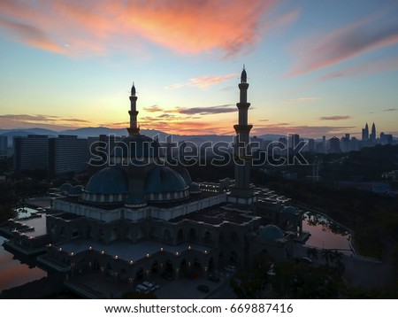Aerial Photo - a mosque at dawn/sunrise. Soft Focus, vibrant colors.