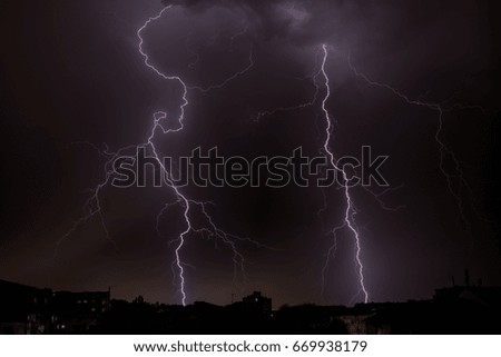 Thunderhead and Lightning Over City