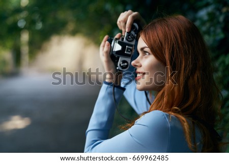 Woman taking pictures                               