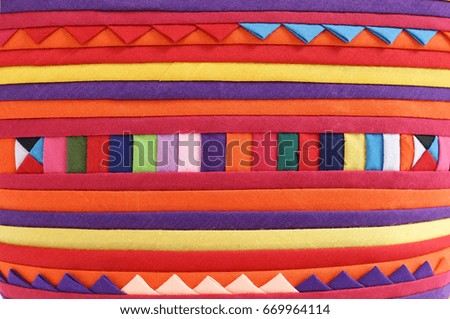 Colorful fabric texture background. Inspiration from tribal pattern. Popular souvenir.