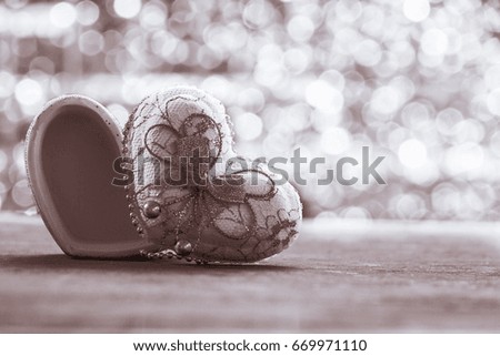 heart box shape on wood with bokeh background .