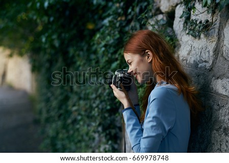Woman taking pictures                               