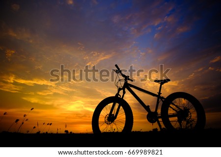 Bicycle on the sunset background Photographed with backlight technique. light Twilight.bike.