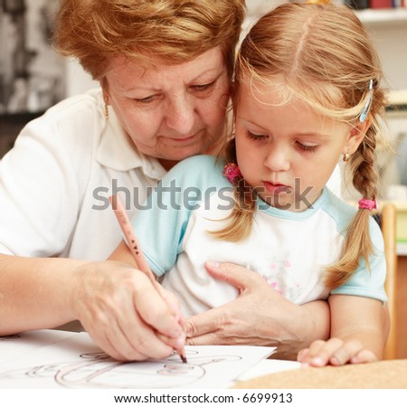 Grandma and grand-daughter painting