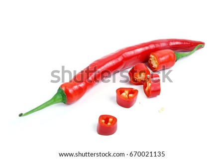 Red chilli or chili peppers cut into pieces isolated on a white background. Royalty-Free Stock Photo #670021135