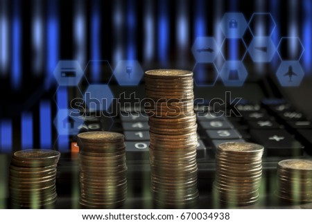 Business Finance Accounting E-commerce Financial speed,Coins stacked together with calculator On the black floor And Decorated with Icon image graph,