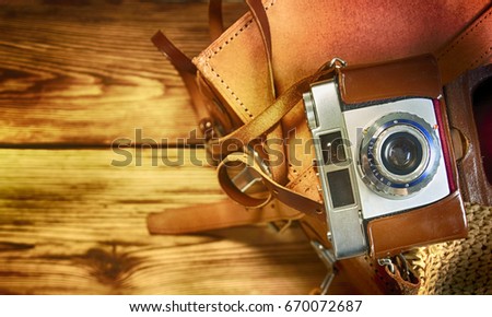 Old photo camera, travel concept