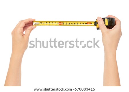 Female hands hold a tape measure to measure the size. Isolated on white background Royalty-Free Stock Photo #670083415