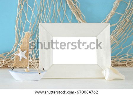 Nautical concept with sea life style objects on wooden table. For photography montage.