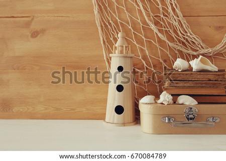 Nautical concept with sea life style objects on wooden table.