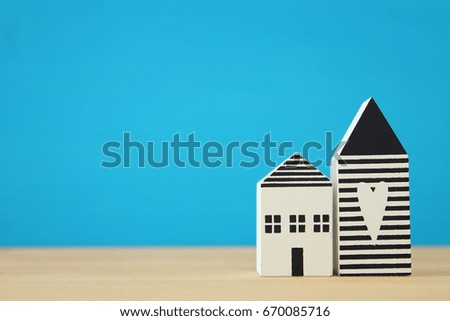 small house model over wooden floor. selective focus.