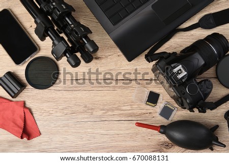 Equipment for independent photographers put on wooden floor.
