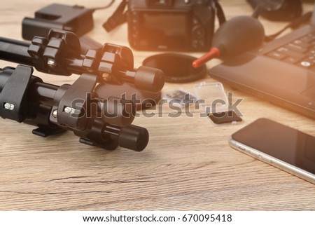Equipment for independent photographers put on wooden floor.