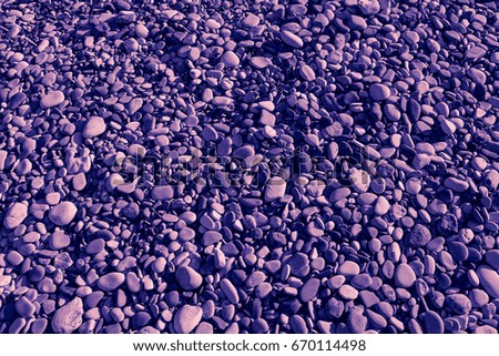 Purple colored stones of the beach of Aphrodite. Souvenirs as a gift. The rock of the Greek (Petra tou Romiou). Paphos region. Cyprus island. Background