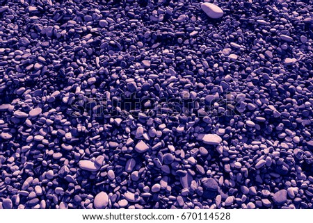 Purple colored stones of the beach of Aphrodite. Souvenirs as a gift. The rock of the Greek (Petra tou Romiou). Paphos region. Cyprus island. Background