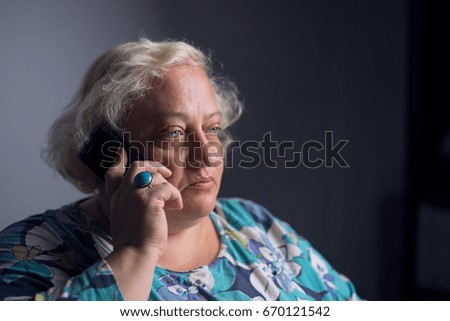 woman calls a black background