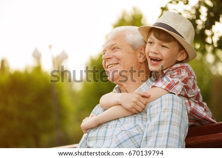 Shot of a happy senior man smiling looking away his grandson hugging him from behind copyspace relax family love people children retirement vitality lifestyle parenting childhood values weekend Royalty-Free Stock Photo #670139794