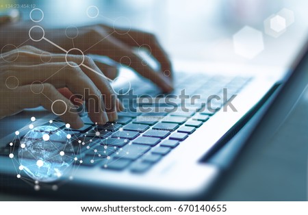 businesswoman hand working with modern technology and digital layer effect as business strategy concept / soft focus picture / blue tone
