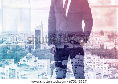 Marketing concept. Double exposure of business man and cityscape background