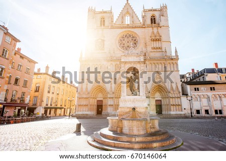 View on the saint Johns cathedral with the statue of Jesusd uring the sunrise in the old town of Lyon city Royalty-Free Stock Photo #670146064