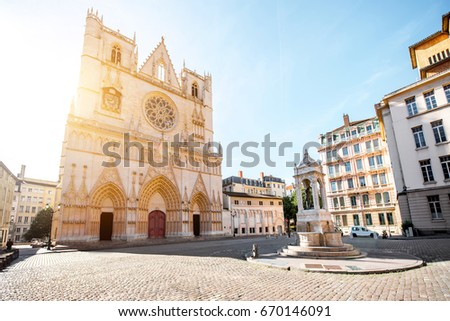 View on the saint Johns cathedral with the statue of Jesusd uring the sunrise in the old town of Lyon city Royalty-Free Stock Photo #670146091