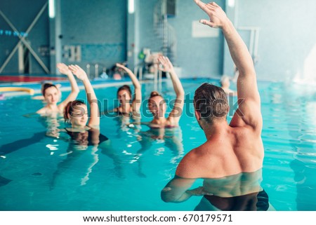 Aqua aerobics in water sport center Royalty-Free Stock Photo #670179571