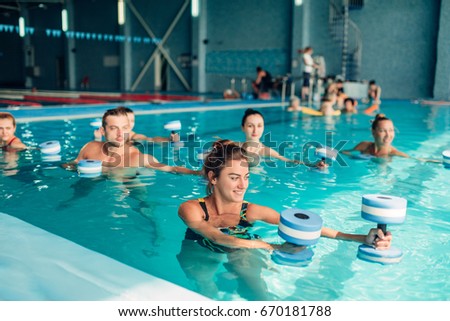 Aqua aerobics, healthy lifestyle, water sport Royalty-Free Stock Photo #670181788