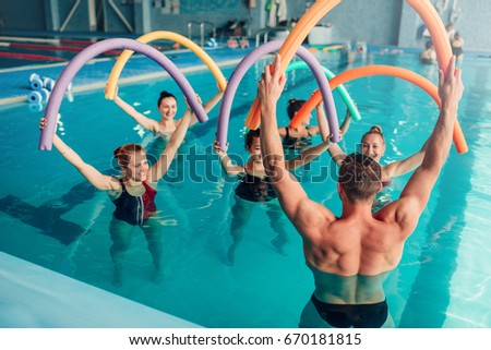 Aqua aerobics, healthy water sport Royalty-Free Stock Photo #670181815