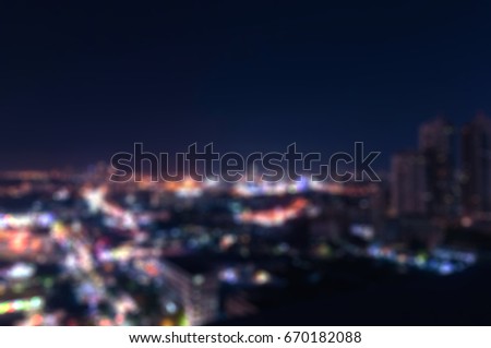 Blurry Bangkok night view with skyscraper in business district in Bangkok Thailand