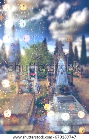 Abstract concept of death and passage of time with grave in the cemetery on rainy day. Cemetery and tombstone detail